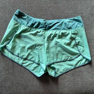 Patagonia athletic shorts, teal with tropical design waistband